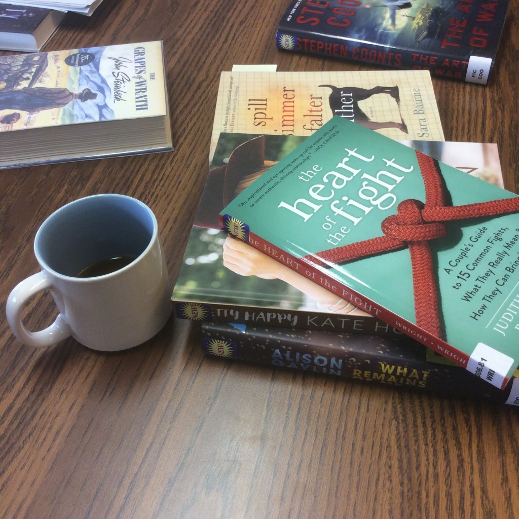 Coffee cup and books
